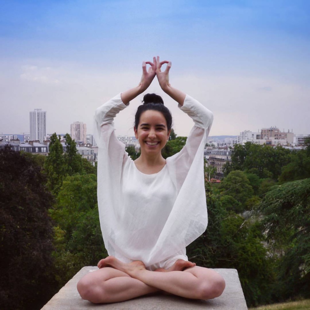 Alexia seated in a pranayama practice